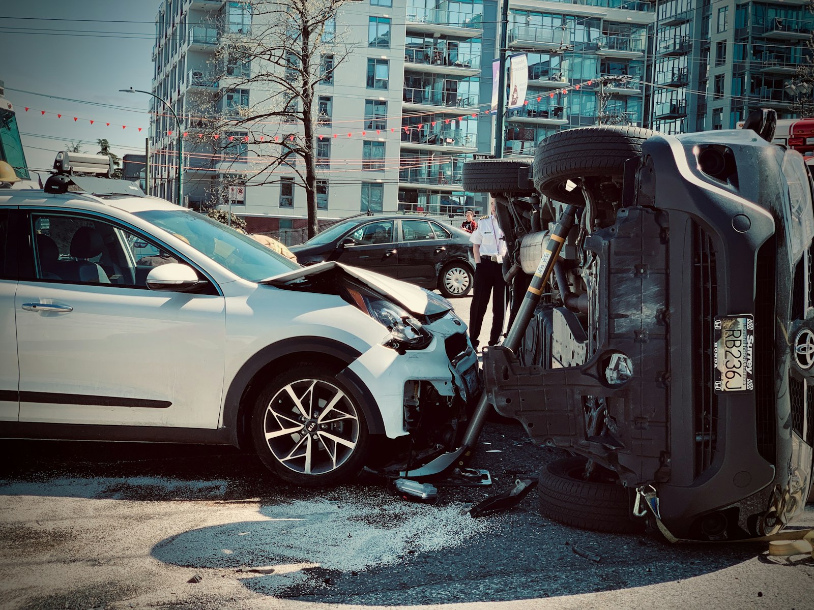 Two cars damaged in a collision at an intersection