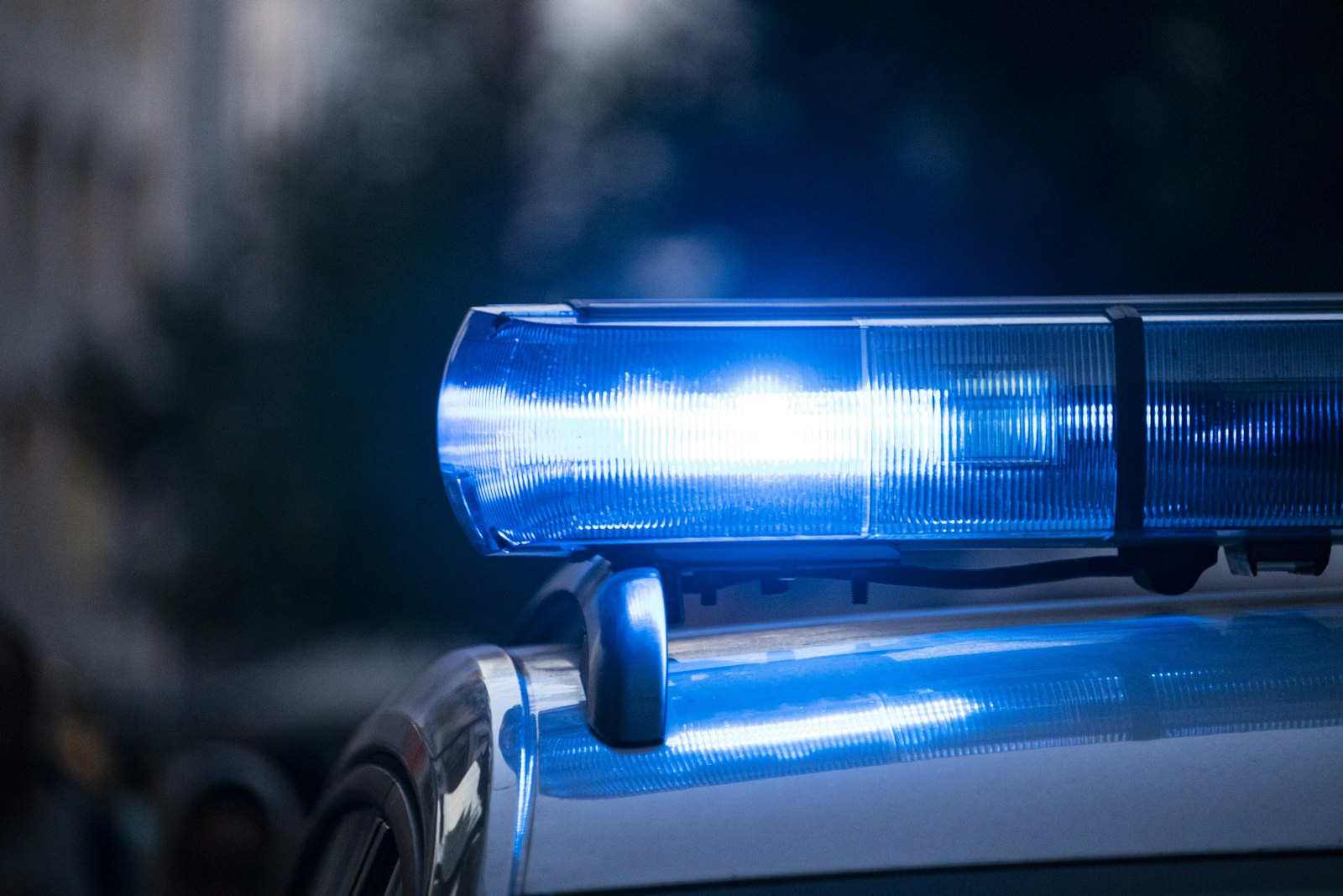 Police car lights flashing at night
